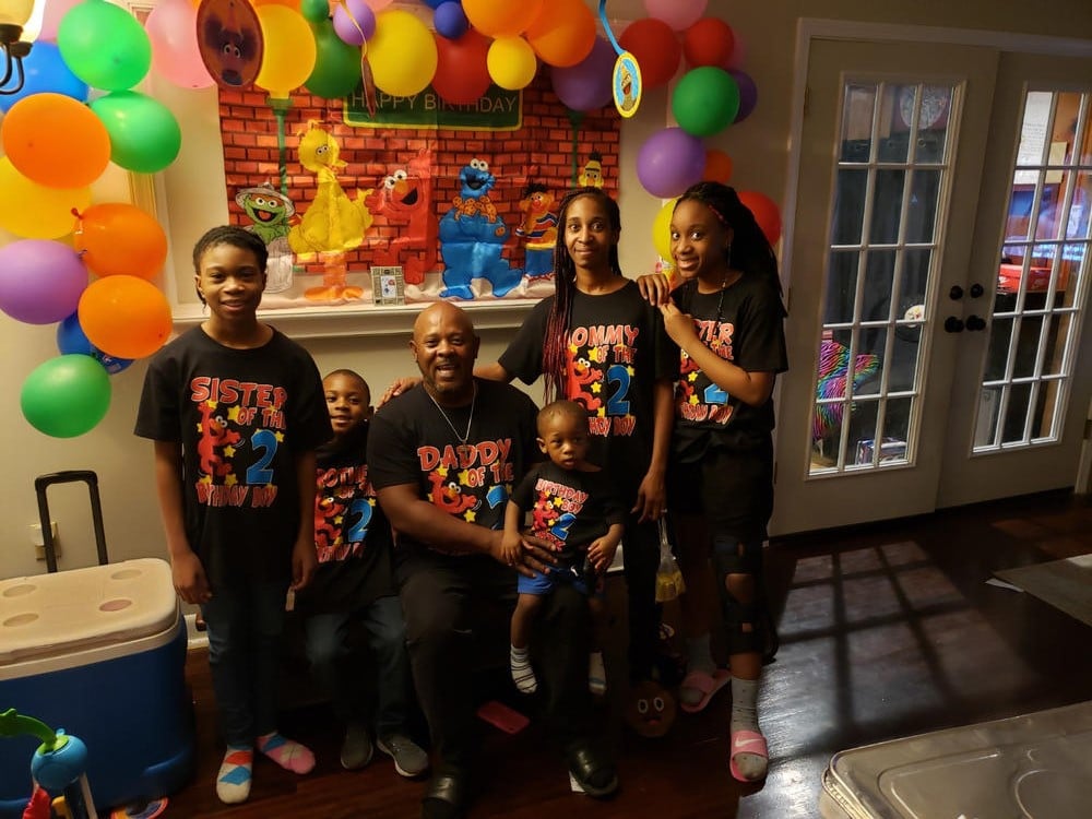 Toria and her family with their Sesame Street custom birthday t-shirts
