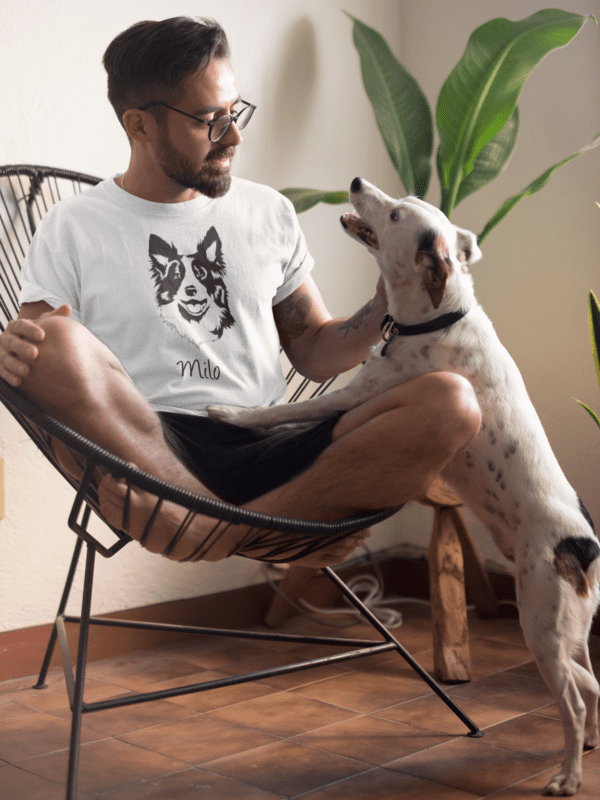 tee mockup of a man sitting on an acapulco chair petting his dog 18085